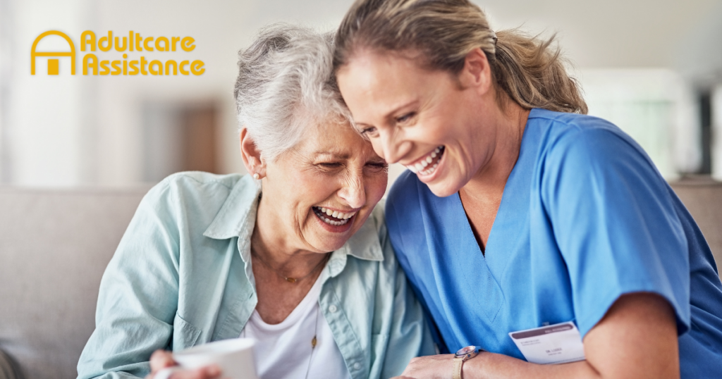 A woman who is providing companion care and her senior client laugh and enjoy their time together.
